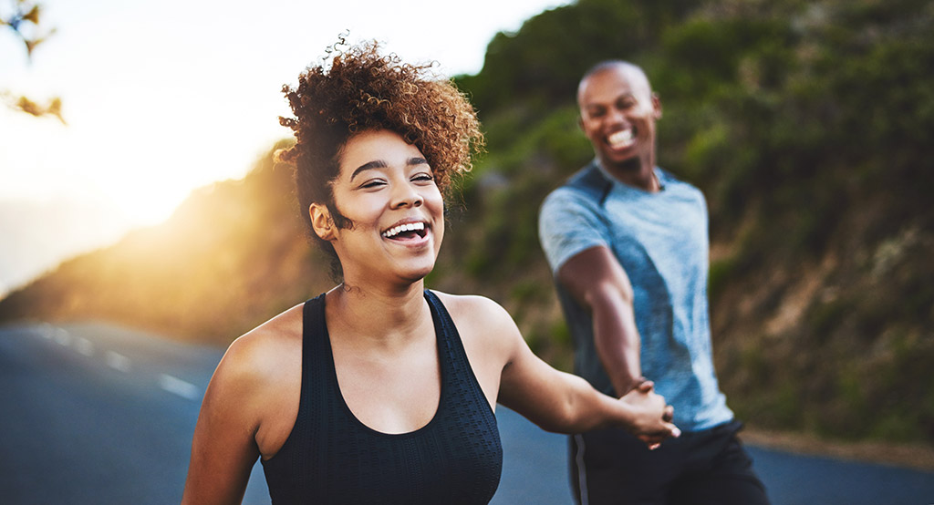 Cropped shot of a happy young couple out for a run together