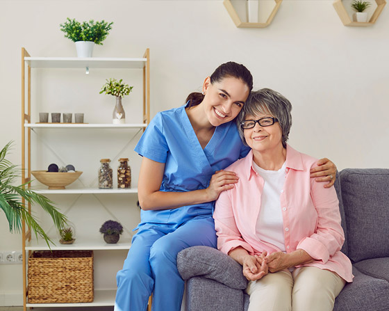 Young nurse with patient smiling