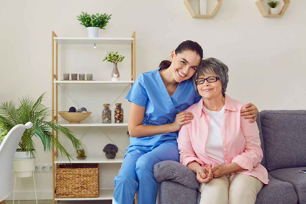 Young nurse with patient smiling