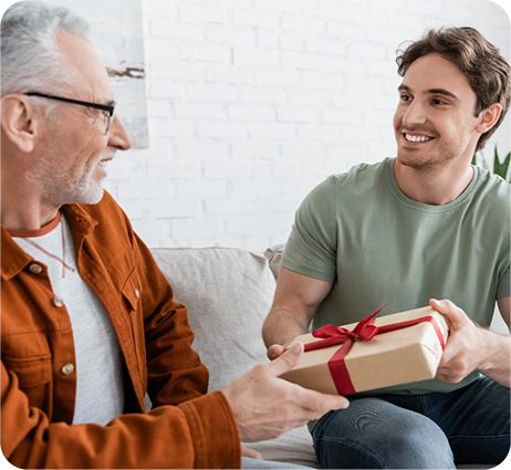 Son giving father gift