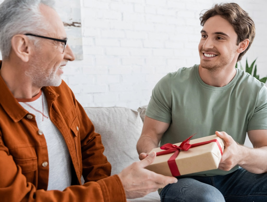 Son giving father gift mobile